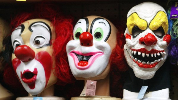 Creepy clown masks. Photo by Tim Boyle/Getty Images. 