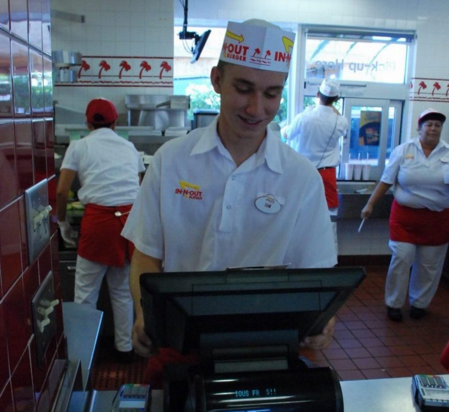 Junior Samuel Cafferty working at the In-N-Out cash register. 