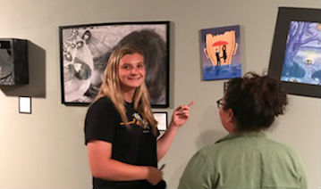 FUHS students admire the artwork in the gallery. Photo by Maggie Crail. 