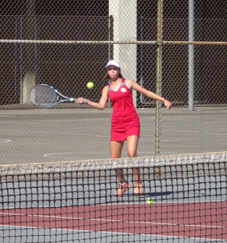 Eliza Lynch launching the ball during a match