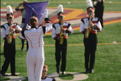 Drum Major Katie Trimble directs.