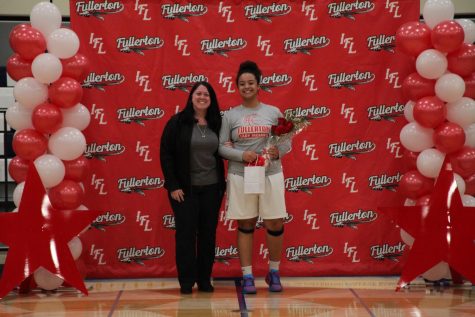 Senior Destiny Cobb standing next to her mother before the game in celebration of senior night. Photo courtesy of Maddy Torresluna.