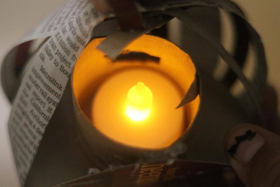 Betsy Barreto and Karen Ruiz created pumpkin lanterns to hang on the journalism door.