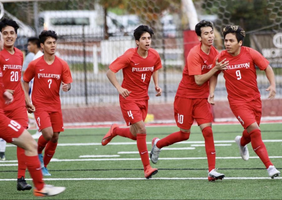 The boys soccer team celebrates Joseph Espinoza’s goal in the 3-1 win against La Habra on Jan. 8. Photo by Jose Perez.
