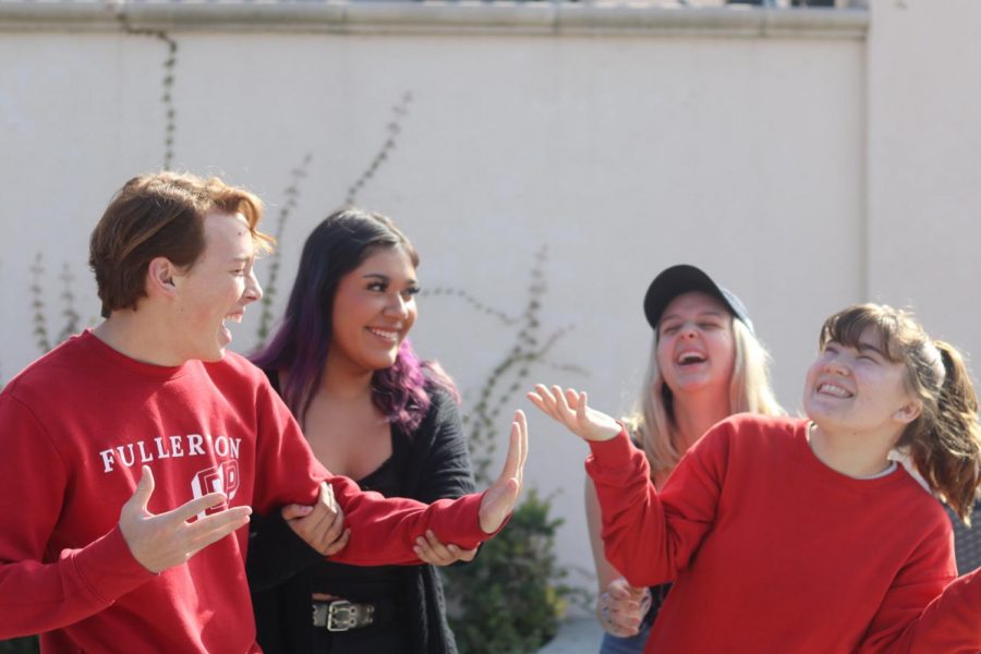 Sophomore Jonah Blake, senior Tahlia Flores, senior Emily McCardell, and junior Karina Hunt practice for the upcoming Valentine’s Day themed match. Photo by Arashk Alivandi.