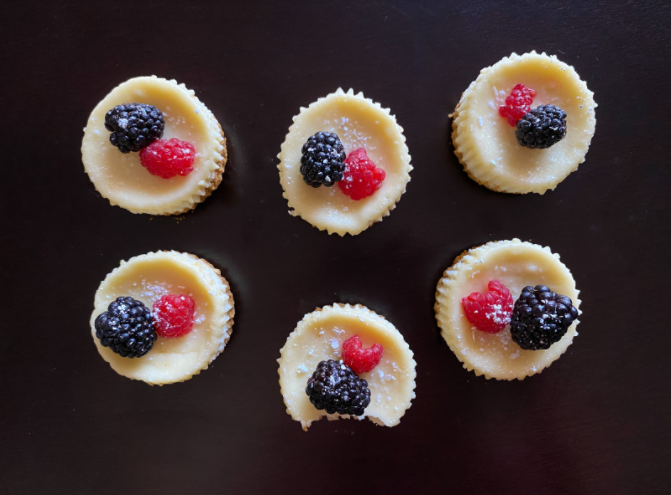Mini cheesecakes topped with berries and a sprinkle of powdered sugar. Photo courtesy of Veronica Gonzalez.