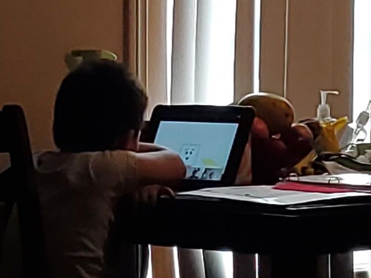 Ian, age 4, works on his iPad for his Pre-K class. Photo courtesy of Alexia Ocampo. 