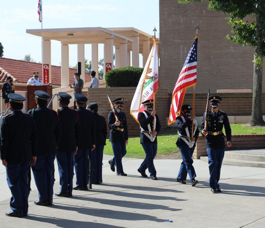 (Front to back) Juniors Christopher Osborn, Julia Bustamante, Austin Hulsizer and sophomore Aydin Hurt performed an Honor Guard Ceremony during break on Sept. 10 in the academic quad as part of a 9/11 tribute hosted by the Fullerton JROTC. The Chief of the Fullerton Fire Department came as a guest speaker. 