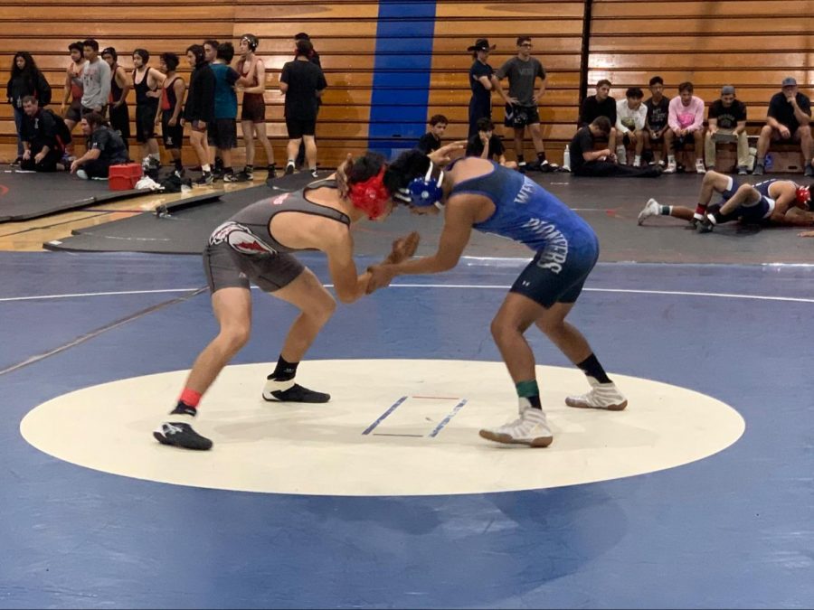 Freshman, Cristobal Garcia competes in a match against the Western High School pioneers.