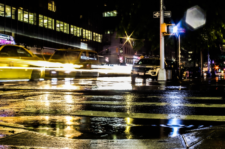 Senior Lawson Turrietta chose to take a colorful, reflecting, and contrasting photo on a trip of his to New York.  He wanted to show how water adds depth to a picture that one wouldn’t expect. 
“Well I was going to go out regardless, but I didn’t know that the rain was going to help make the picture that much better,” says Turrietta, “But when I look back at the picture, I was glad that it rained.”
He had to take many photos in order to get one good picture of the light reflecting off the water on the ground. He then edited to make the lights shine brightly in contrast to the dark background.