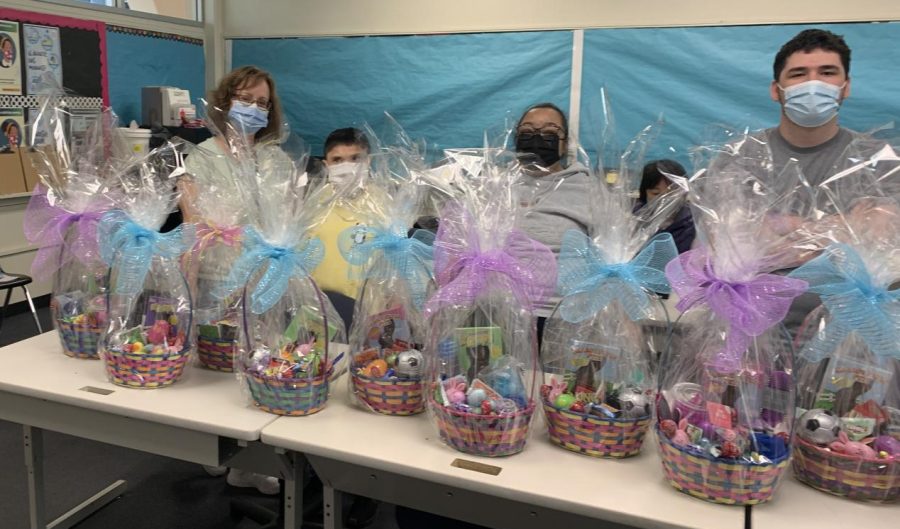 ATP students made 11 Easter Baskets for Olive Crest Academy students. (Left to right) Instructional aide Stephanie Smith, Ivan Galvan, Luz Gomez and Shawn Peterson.