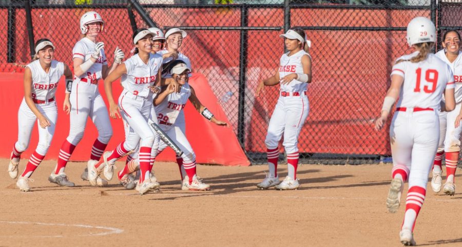 The team celebrates Allie Yurek’s walk-off double in the 9th inning against Buena Park on April 5.
