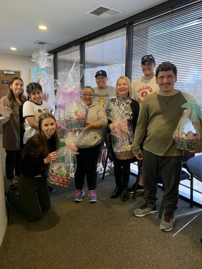 ATP Teacher Kathi Pope and Instructional Aide Satchel Fitzsimmons help students Atzari Estrada, Luz Gomez, Manny Juarez, and Shawn Peterson deliver their Easter baskets to Olive Crest Academy in March.