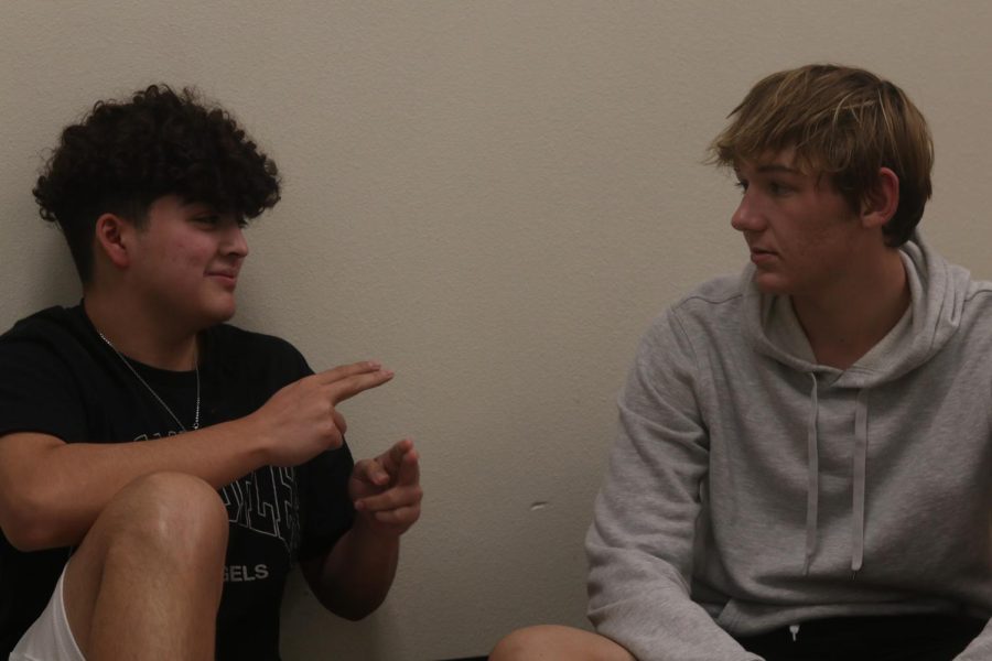Juniors Aidan Guillan (left) and Braiden Feckley (right), along with other ASL 3 students, are waiting to take an only American Sign Language class through Cerritos College.