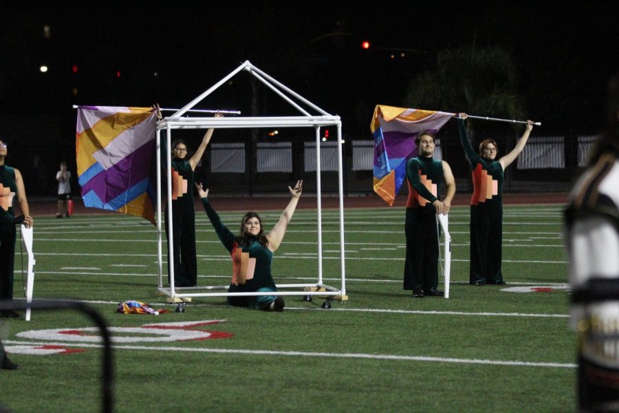 The marching show, titled Blueprints, is about building teamwork and features the use of a house prop being built throughout the show. 