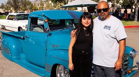 Tribe Tribune reporter Elany Zavala poses with her dad Beto Millan in front of his lowrider, a 1949 Chevy pickup truck.