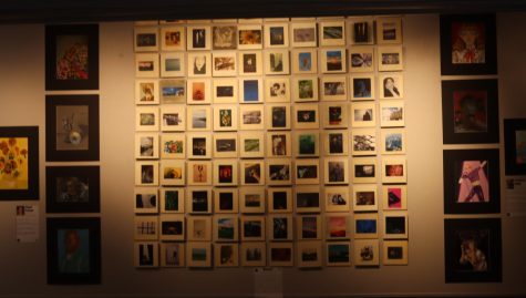 It takes time and care to plan and display student artwork in Gallery 201. Student curators spend hours managing the space.