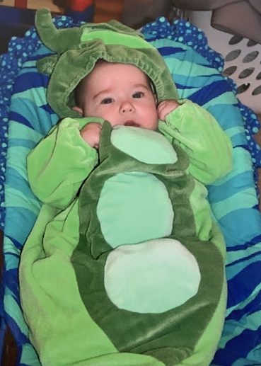 Baby Janae dressed up as a pea pod.