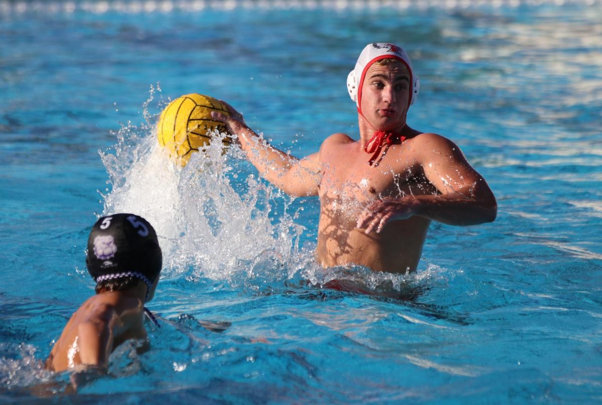 Junior Justin Pearson attempts a shot at a preseason match against Portola.
