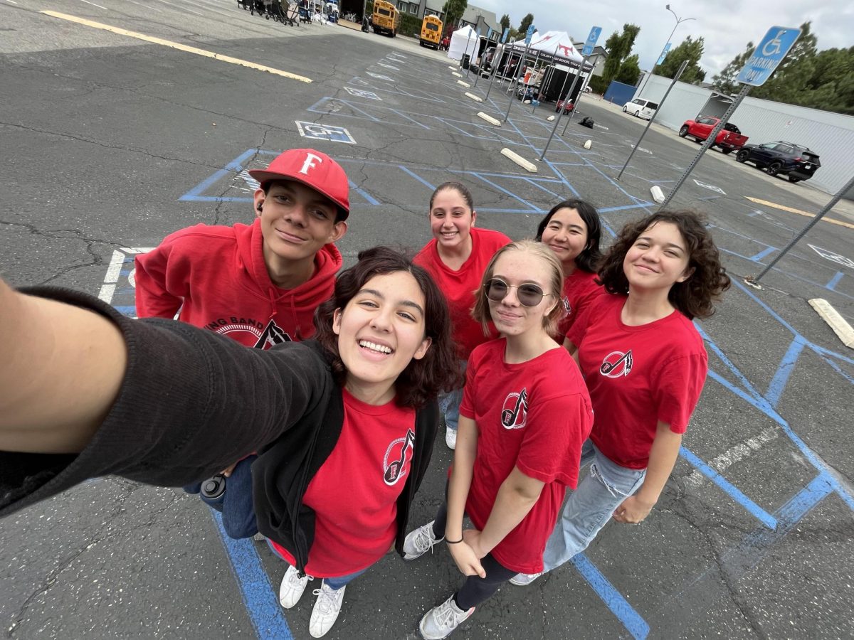 Evelyn+takes+a+picture+with+her+flute+section+during+a+marching+band+clinic.+From+left+to+right%2C+junior+Devyn+Jacobo%2C+senior+Hannah+Day%2C+freshman+Emily+Ito%2C+freshman+Katelyn+Rodriguez%2C+and+freshman+Audrey+Chappell.+After+two+years+from+having+about+2-3+flute+players+Evelyn+feels+exceedingly+happy+that+she+can+lead+5+other+flutists.