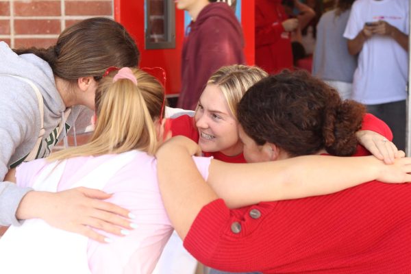 Kerr (back middle) is shown huddling with three of her ASB juniors (left to right): Abbey Lucey, Abigail Kelly, and Victoria Castellanos. In all of her classes, Kerr does her best to encourage a close community between students. As the ASB advisor, Kerr stays heavily involved in school activities and events and ensures her students have all the necessary tools to be successful.