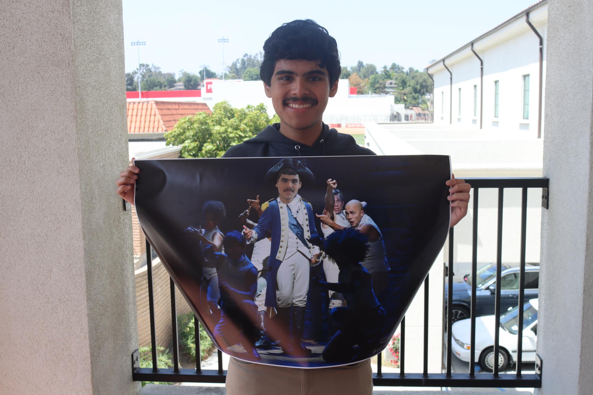 Piña-Villanuevas first real role was as George Washington during an elementary school play. Here, he holds a photoshopped poster created by Eadyn Ochoa.