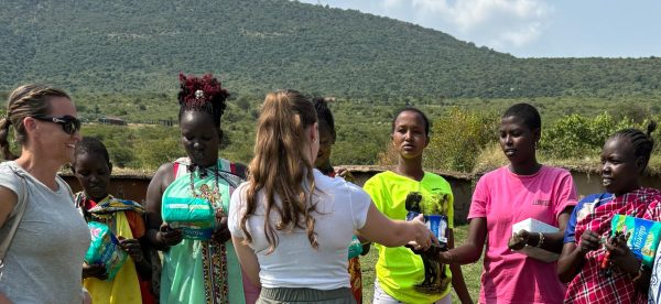 FUHS French teacher Alexandra Walker (pictured left) visited a Maasai Mara tribe in Kenya where her family distributed about 400 pads donated by the FUHS Period Club. Many of the products were originally purchased by Fullerton NHS students and their families. Photo courtesy of Alexandra Walker