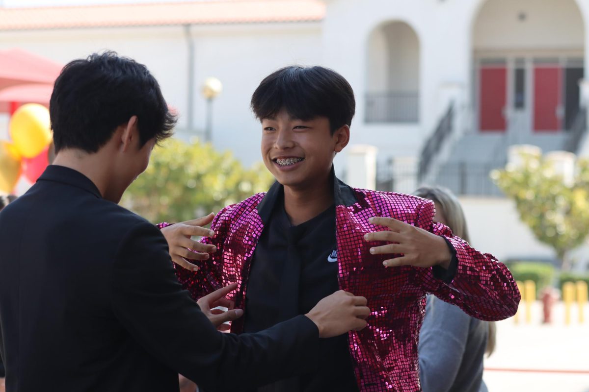 Freshman Tyler Lee (right)is showing off his Flashy jacket to Sophomore Jayden Bae (left) (Photo by Josie Lee)