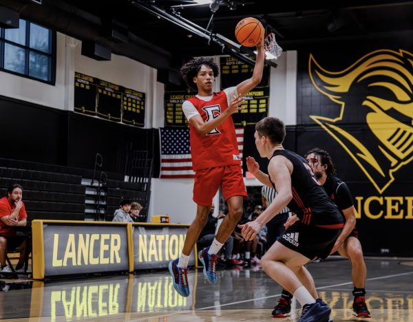 Senior Jordan Myvett jumps to receive a pass during the Tribe’s 42-39 loss against Sunny Hills on Dec. 10.