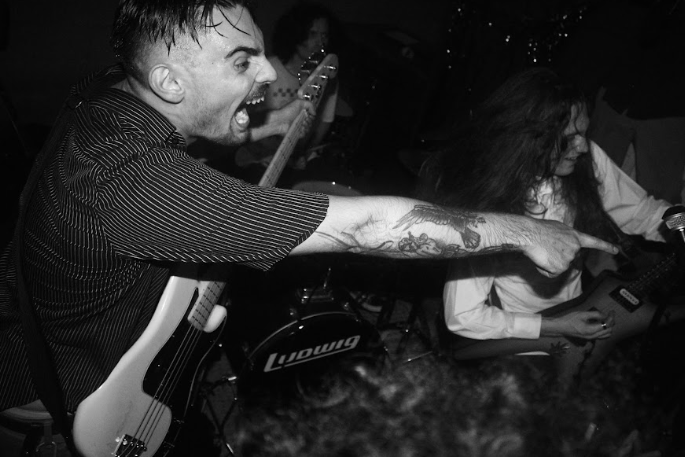 Alyssa attended a punk-themed prom show over the summer in Santa Ana called Morp. The bassist is seen pointing at someone enjoying the music to cheer him on. 