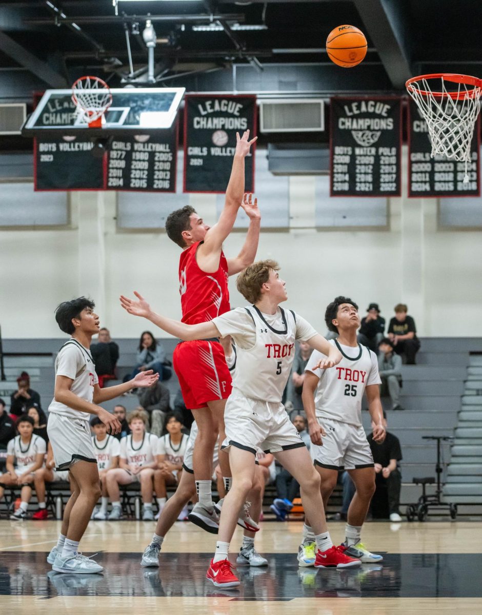 Senior Lincoln Sailhamer puts up a shot against Troy High School in a non-league game.