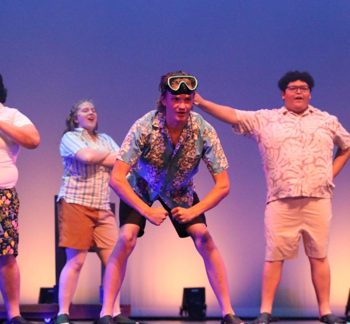 Technical theater student Jett Shields (left) makes his FUHS stage debut dancing in swim gear for Mamma Mia! (Jasmine Java)