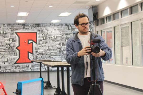 Photo teacher Brayden Hall filmed the Top 25 Senior Rotary winners in the gym March 10-11. Hall will also edit the video interviews for the school website.