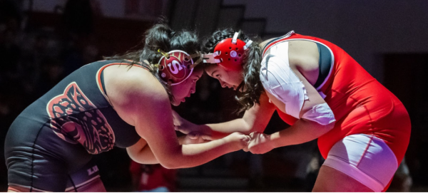 (Right) Senior Janessa Gallardo wrestles her opponent in the 42-18 win against Segerstrom on Jan 8.