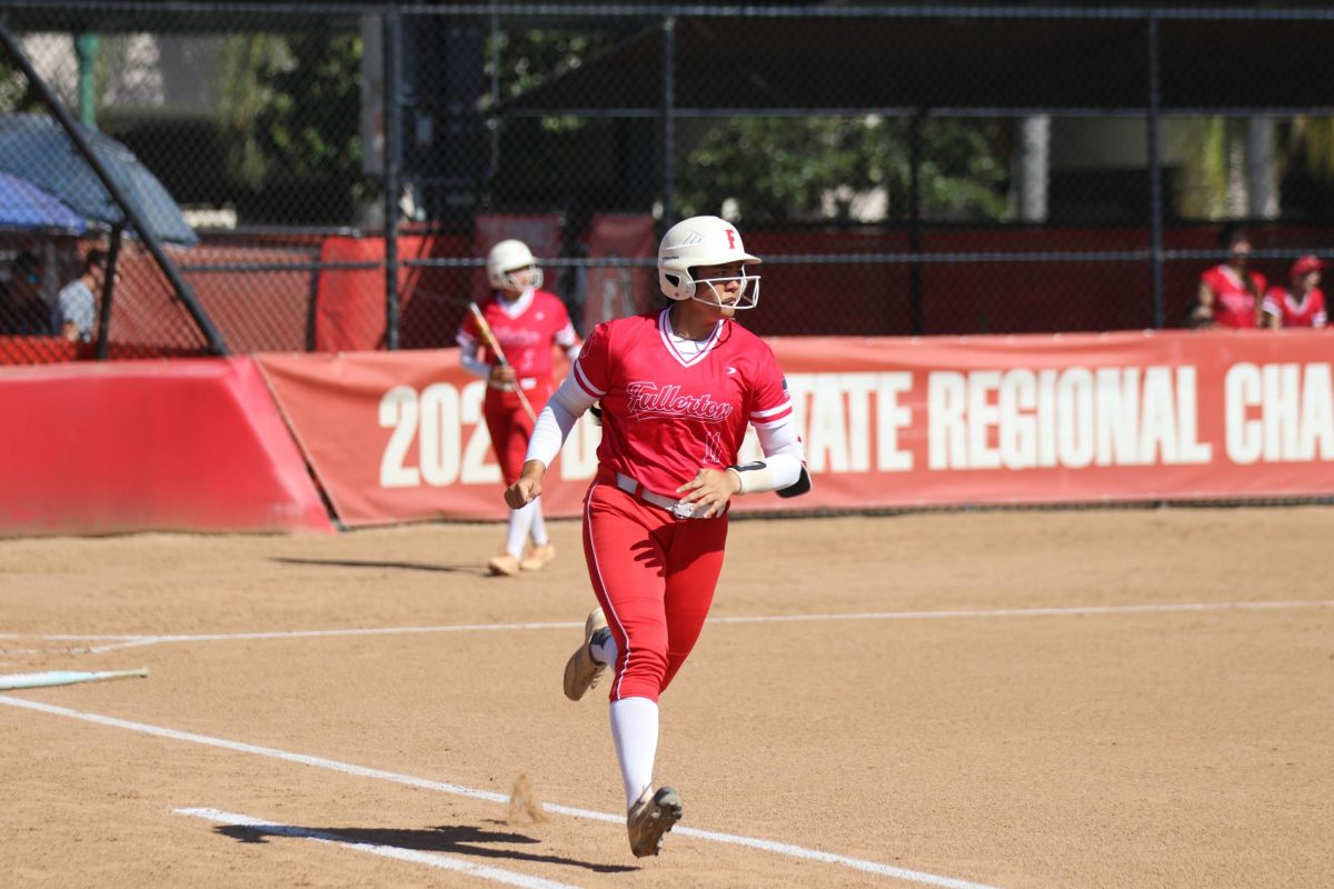 Junior Malaya Majam-Finch runs to second after hitting the ball into right-field.