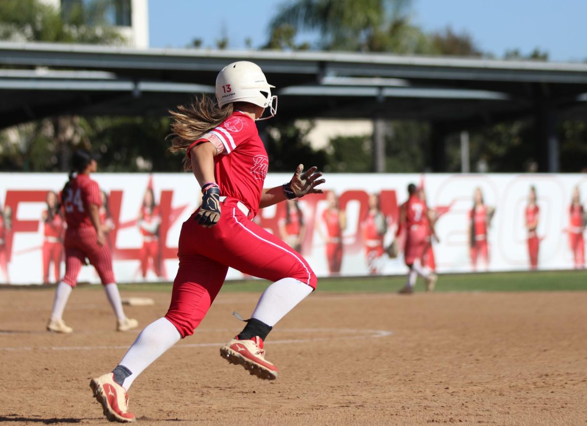 Junior Hayley Brock runs to second after a hit by Malaya Majam-Finch.