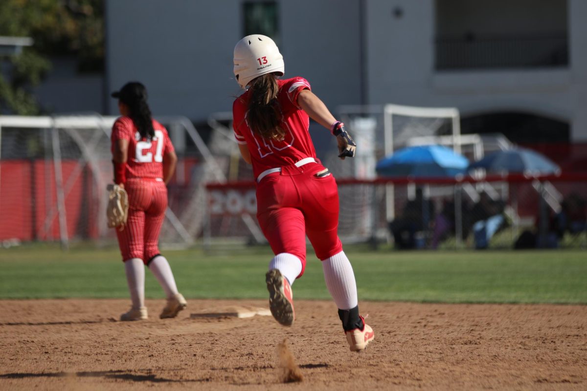 Junior Hayley Brock advances to second after a hit by junior Malaya Majam-Finch.