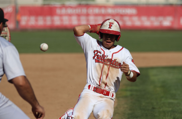 Senior Christian Robinson runs into third safely in a league match-up against Tustin on March 25. (Photo courtesy of Madison Sibal)
