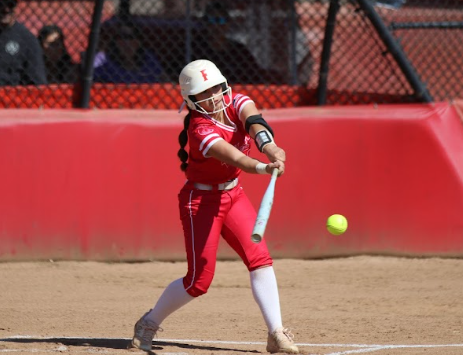 Junior Melia Vera swings the bat.