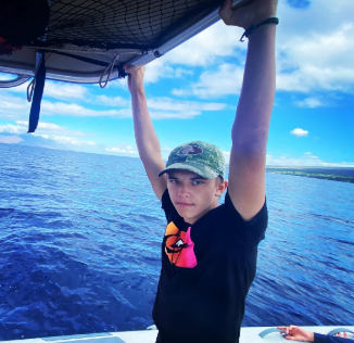 Martyn fishing with his family in Hawaii. He would later buy a fishing rod in Fullerton to get his mind back on track from his fathers death. (Photo by Ezra Martyn)