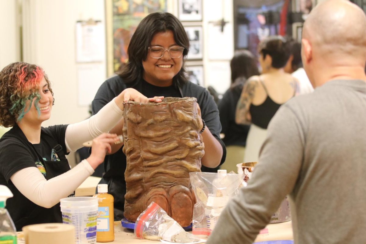Alumni CADE students working to create the mammoth for The Skin of our Teeth.

