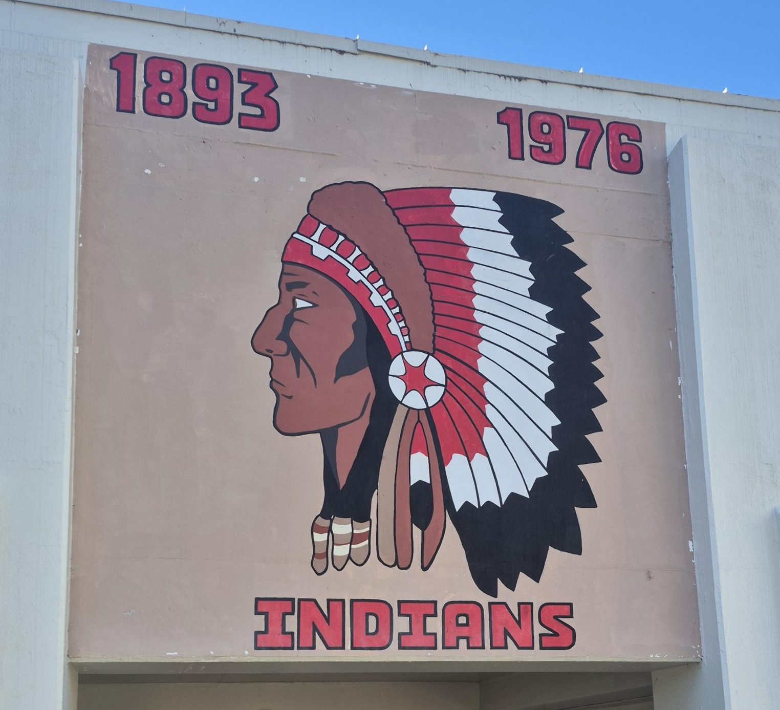 The school will need to remove the mural depicting the Indian mascot from the front of the English building. The mural was a gift from the Class of 1976. 