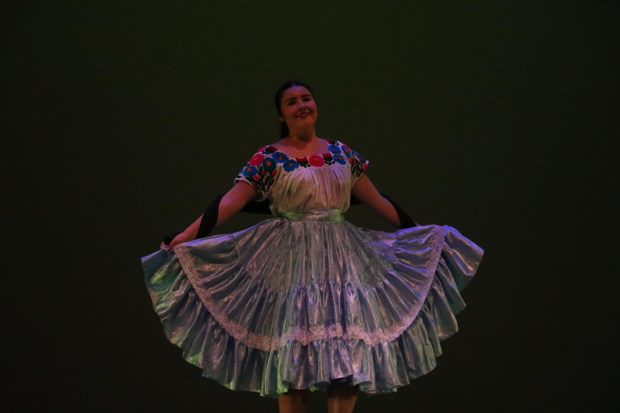 Senior Cytlaly Ruiz Velazquez borrowed a Folklórico style dress from a friend to keep her dance concert performance a surprise for her parents.