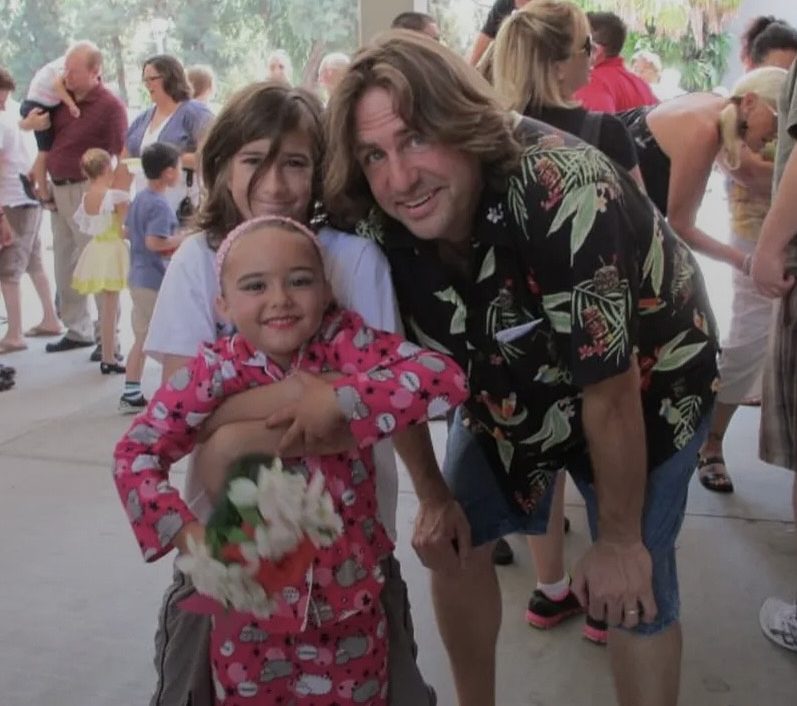 Andromeda Bruschke appreciates her supportive family, including her father and sister celebrating after a dance recital.