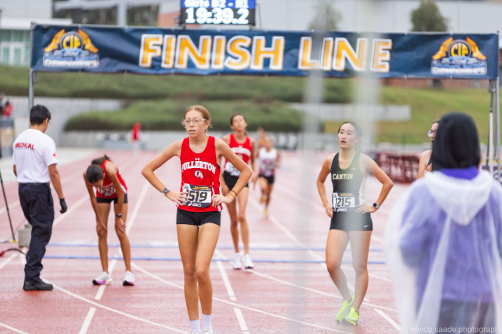 The Fullerton cross country teams had to run in the rain Nov. 15 at Mt. Sac for the CIF Prelims. Running an alternate course of mostly concrete was particularly exhausting for junior team captain Keely Gallagher who had a personal best 18:27 for the 3 mile this year, but ran a 19:27 in the harsh weather at prelims.