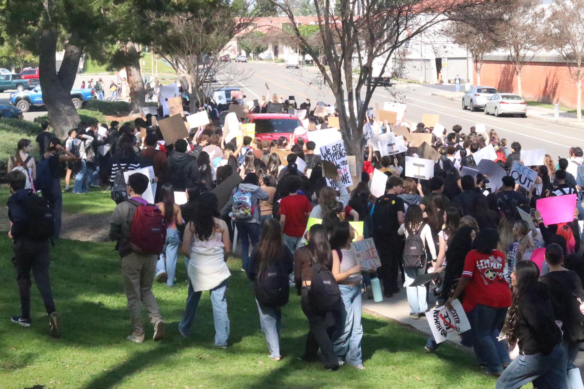 Students march down N. Berkeley in unison at 12:45 p.m.