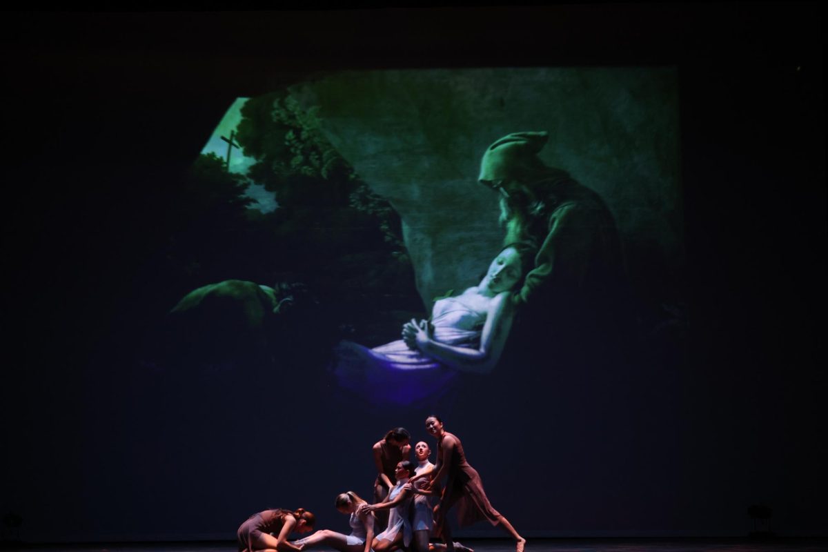 The paintings the dances were inspired by are projected on the stage at certain points, as seen here with "The Burial of Atala."