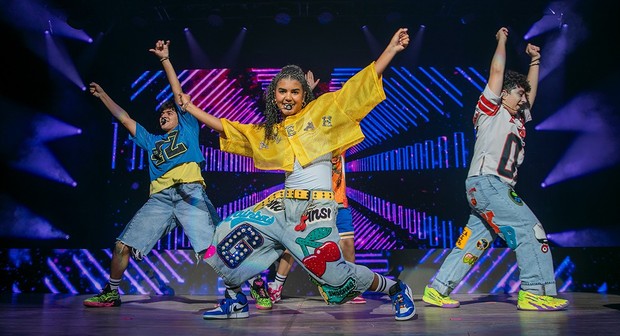 Aleah Crew (center) performs in front of fans at the Honda Center on Sept. 21, 2025. Her performance with KIDS BOP Live was edited into a full-length film that was shown in theaters Jan. 2-5 as part of a Live Nation event. (Image from Fathom Entertainment)